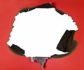 Burned Hole In Red Paper Royalty Free Stock Photo
