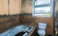 Burned house interior after fire, ruined building a toilet after fire inside