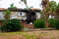 Burned house with major fire damage to siding, windows and roof