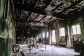 Burned industrial room. Brick wall and reinforced concrete roof plates after a fire Royalty Free Stock Photo