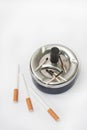 Burned matches in the ashtray and filter cigarettes Royalty Free Stock Photo