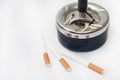 Burned matches in the ashtray and filter cigarettes Royalty Free Stock Photo