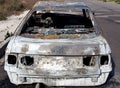 Burned out car in street Royalty Free Stock Photo