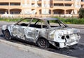 Burned out car in street Royalty Free Stock Photo