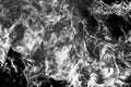 Burned-out chair in a fire close-up on a black background