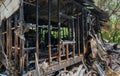 Burned ruins of wooden frame home