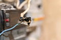 Burned wire, splicing connector, electrical terminal block of nonflammable, fireproof material. Faulty wiring or negligent Royalty Free Stock Photo