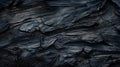 Burned wood texture background, black charcoal close-up. Abstract charred timber, pattern of dark scorched tree. Concept of smoke
