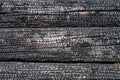 Burned wooden logs wall texture and background Royalty Free Stock Photo