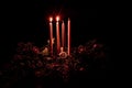 Two advent candles burning on advent wreaths Royalty Free Stock Photo