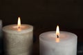 Burning aromatic candles on dark background Royalty Free Stock Photo