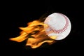 Burning baseball ball flying at high speed on black background