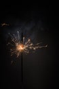 Burning bengal fire stick New year sparkler candle isolated on black background. Realistic sparkler. Magic light stick. Christmas Royalty Free Stock Photo
