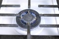 Burning big gas berner on the cooktop gas sove. Gas stove with lattice. Royalty Free Stock Photo