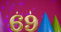 Burning birthday cake candle number 69. Happy Birthday background anniversary celebration concept. Birthday hat in the