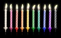 Burning birthday candles isolated on dark background with fire flames. Colorful collection. Clipping path