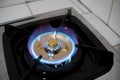 Burning blue flames from a kitchen gas stove Royalty Free Stock Photo