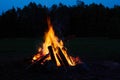 Burning bonfire on a summer evening on st.john party Royalty Free Stock Photo