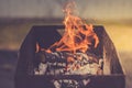 Burning brazier with firewood/burning brazier with firewood, toned Royalty Free Stock Photo