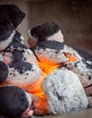 burning briquettes inside the grill Royalty Free Stock Photo
