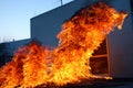 Burning building. Fire. Wirfire. Burning house at night, roof of building in flames and smoke.