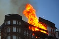 Burning building. Fire. Wirfire. Burning house at night, roof of building in flames and smoke.