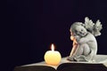 Candle and angel figurine Royalty Free Stock Photo