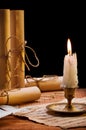 Burning candle and antique items Royalty Free Stock Photo