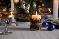 Burning candle on beautiful table setting for Christmas dinner Royalty Free Stock Photo