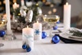 Burning candle on beautiful table setting for Christmas dinner Royalty Free Stock Photo