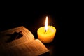 Burning candle and Bible . Christian cross . Royalty Free Stock Photo