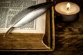 Burning candle and old Bible Royalty Free Stock Photo
