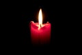 Burning candle on black background Royalty Free Stock Photo