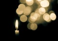 Burning candle on blurred motion light