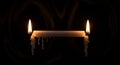 Burning Candle At Both Ends Symbolizing Burnout On Dark Background Royalty Free Stock Photo