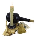 Burning candle with bottle, scroll and key Royalty Free Stock Photo