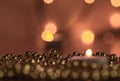 Burning candle and Christmas ornaments Royalty Free Stock Photo