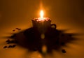 Burning candle and coffee beans Royalty Free Stock Photo