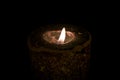 A burning candle in the dark Royalty Free Stock Photo
