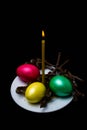 Burning candle and Easter eggs Royalty Free Stock Photo