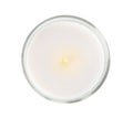 Burning candle in glass holder on white background