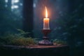 Burning candle illuminates eerie forest, embodying esoteric mystique