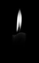Burning candle isolated on black Royalty Free Stock Photo