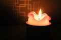 Burning candle on a dark blured background Royalty Free Stock Photo