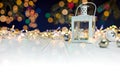 Burning candle lantern and christmas decoration on white wooden Royalty Free Stock Photo