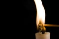 Burning Candle with Match Royalty Free Stock Photo