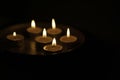 Burning candle on the dark blackground Royalty Free Stock Photo