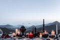 burning candle, moon symbol, amulet and crystal ball lying on a light natural background. Witchcraft, esoteric spiritual