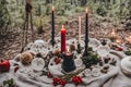 burning candle, moon symbol, amulet and crystal ball lying on a light natural background. Witchcraft, esoteric spiritual