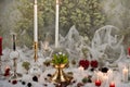 burning candle, moon symbol, amulet and crystal ball lying on a light natural background. Witchcraft, esoteric spiritual